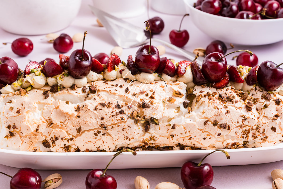 Cherry and Pistachio Meringue Roulade